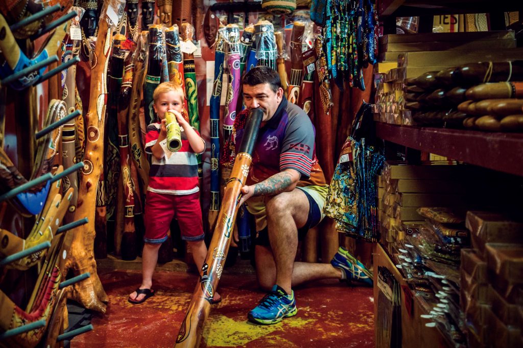 Man and son with didgeridoo at Cairns night markets