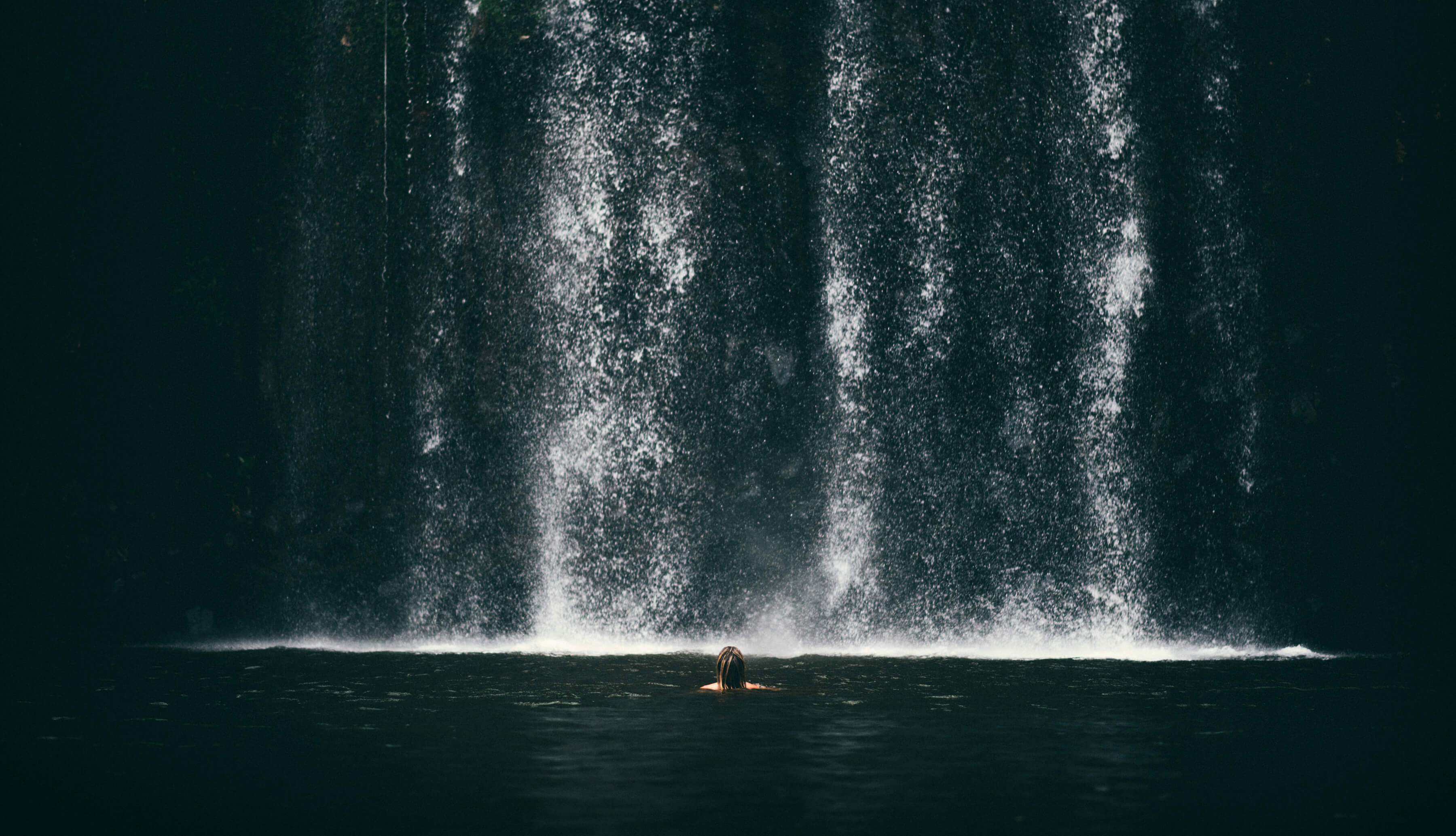 Swimming near waterfall